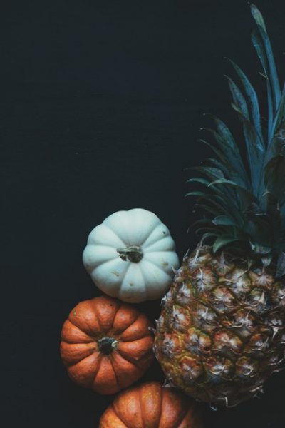 yellow and green pineapple pairs well with orange and white pumpkins